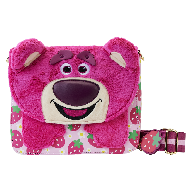 Image of the pink, plush Lotso crossbody bag with strawberry design on the body of the bag